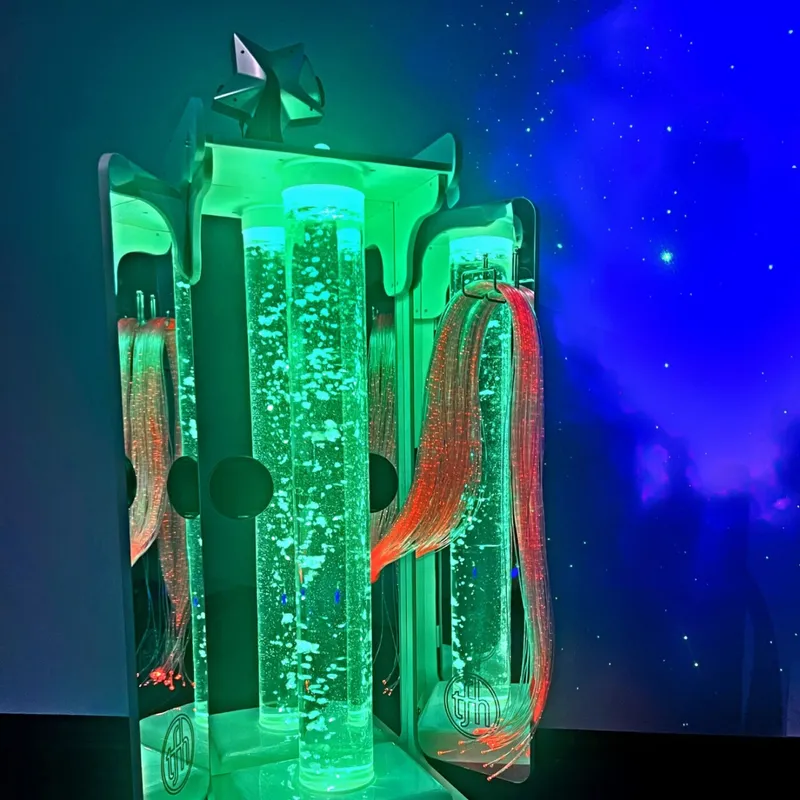 Glowing green bubble tube with fiber optics