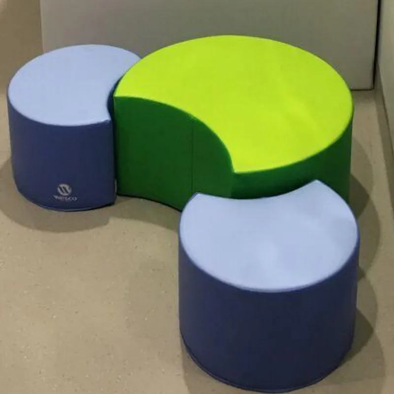 Green crescent with two blue round stools