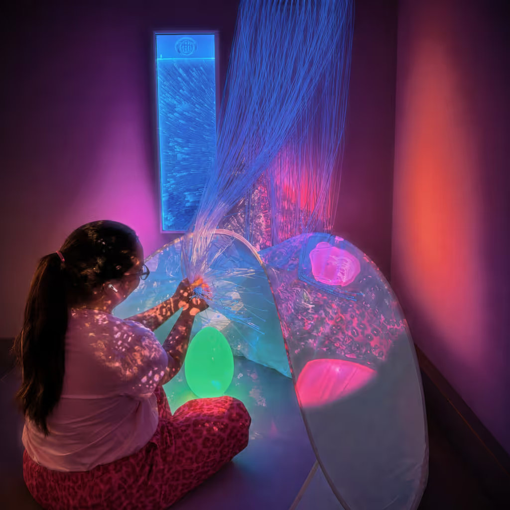 Child in sensory room with fiber-optics