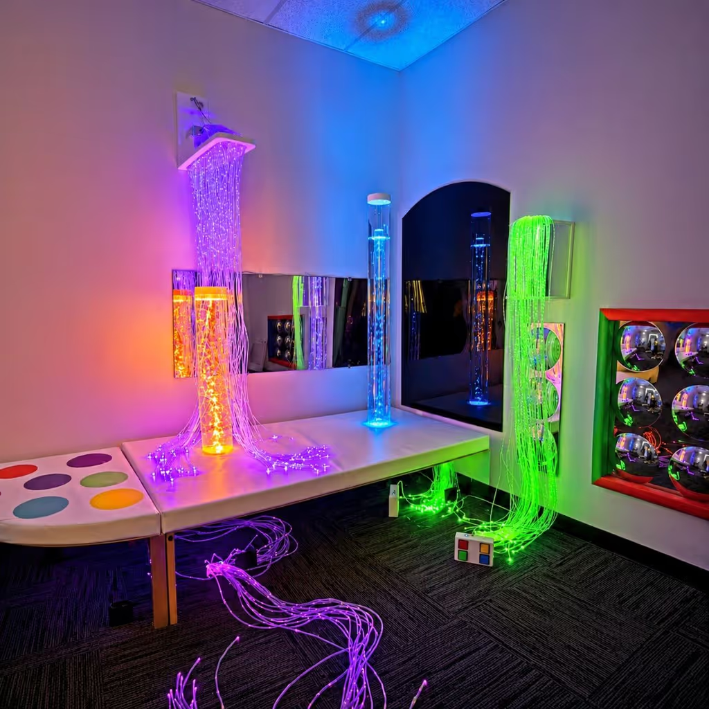 Colorful sensory room with illuminated bubble tubes
