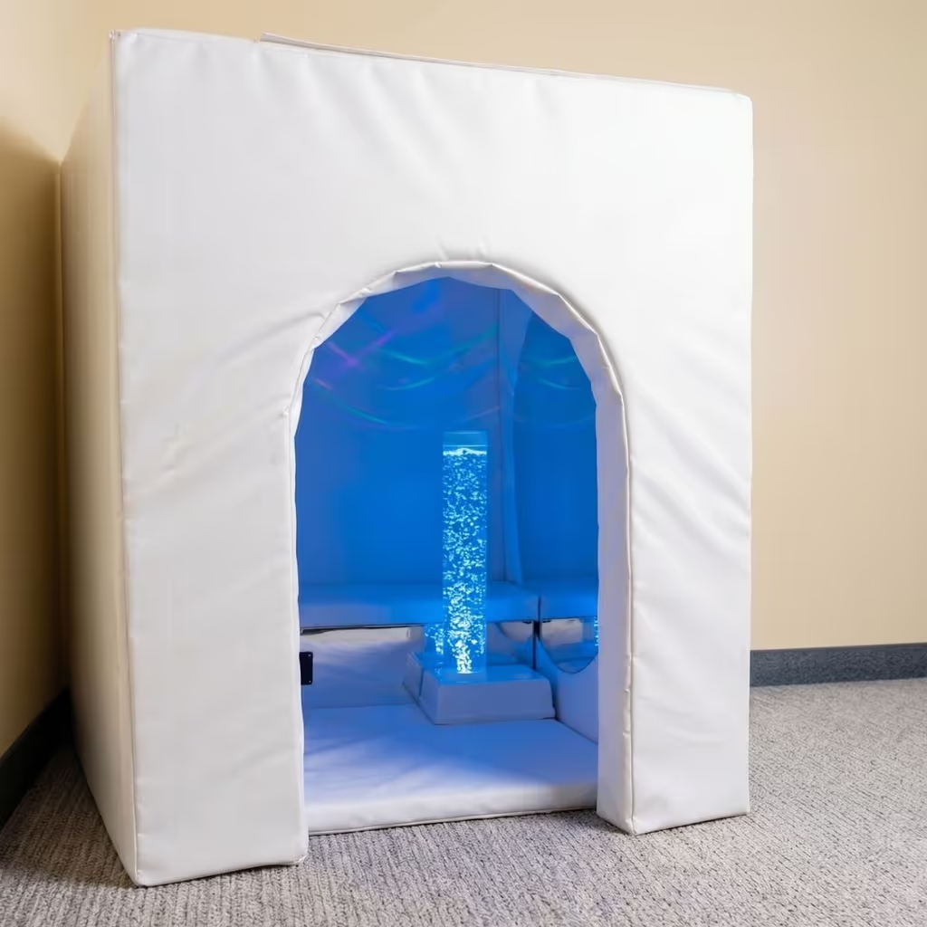 White padded sensory booth with blue bubble tube