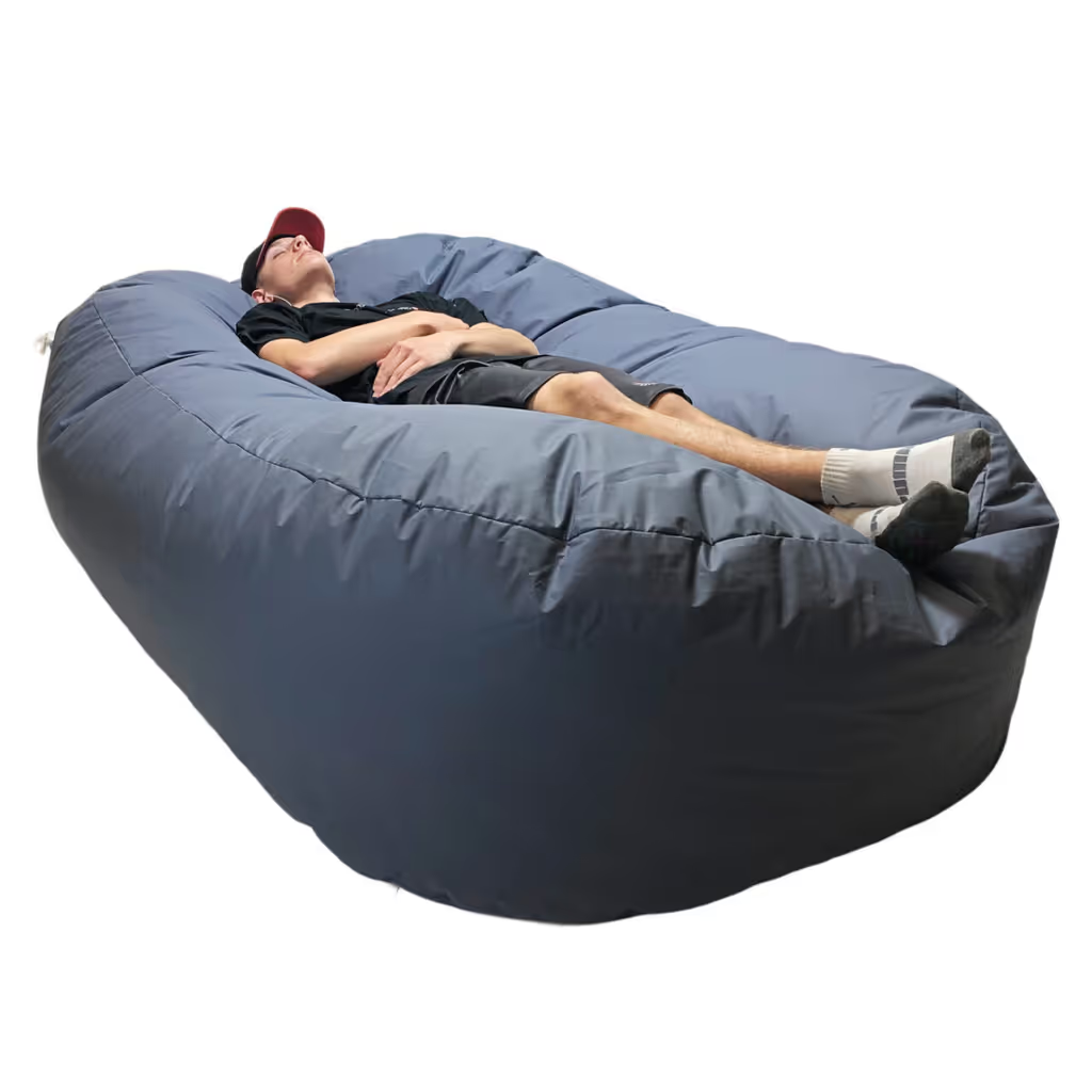 Person reclining on large gray bean bag