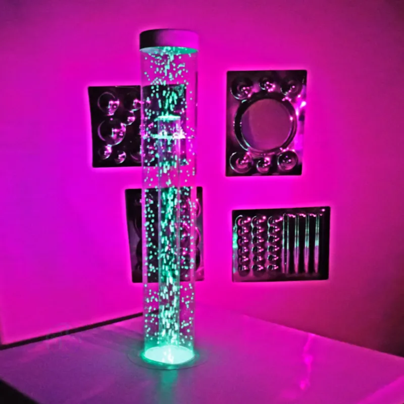 Glowing bubble tube lamp with neon pink backdrop