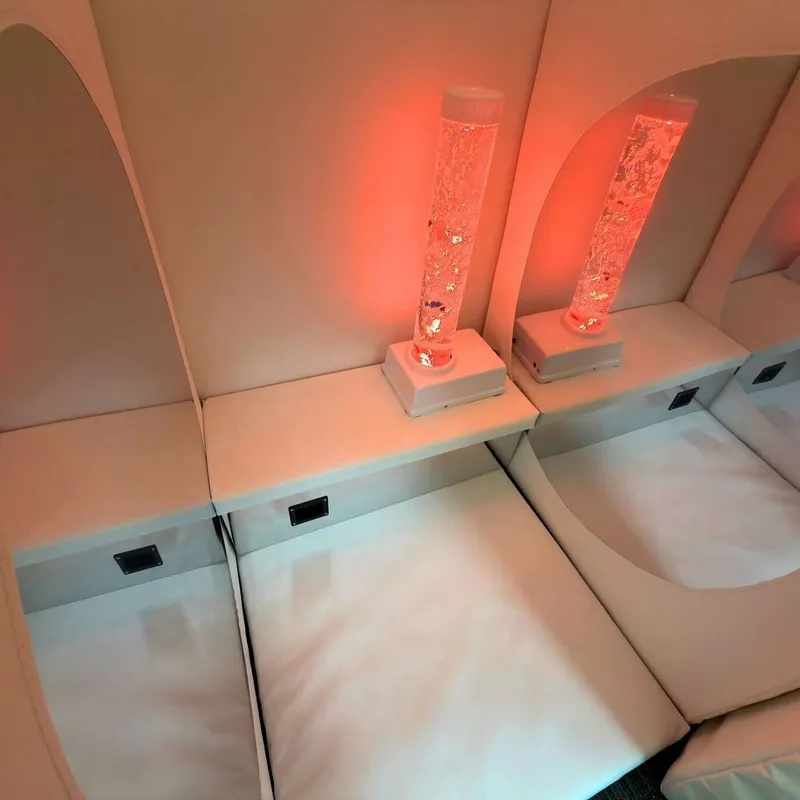 Red bubble lamps on padded pod seating