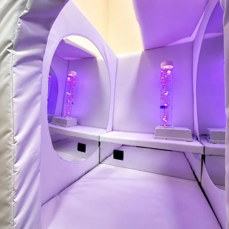 White sensory pod with purple bubble tubes